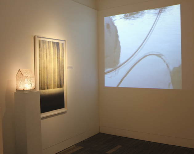 Projection of 'Recurring Dream' and wall piece and house for '....a little rain...'